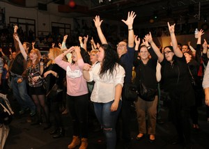Afiliados y trabajadores de la ONCE en Madrid bailan en la celebración de Santa Lucía