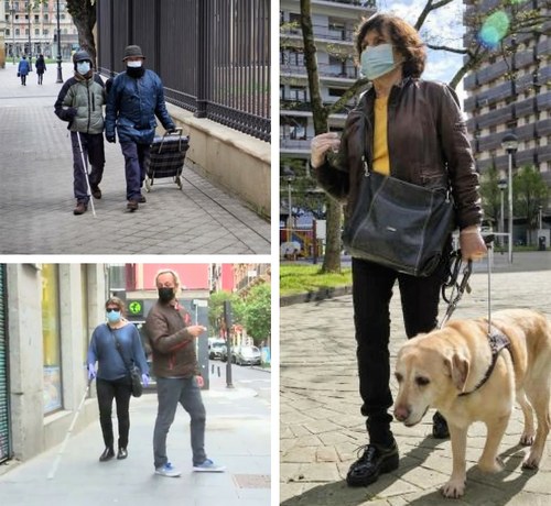 Afiliados con mascarilla en la calle con bastón y perro guía