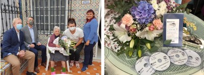 Representantes de la ONCE y vecinas de Pilar la rodean en el día de su cumpleaños