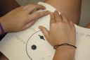 Ficha, en braille y relieve, de un sistema planetario